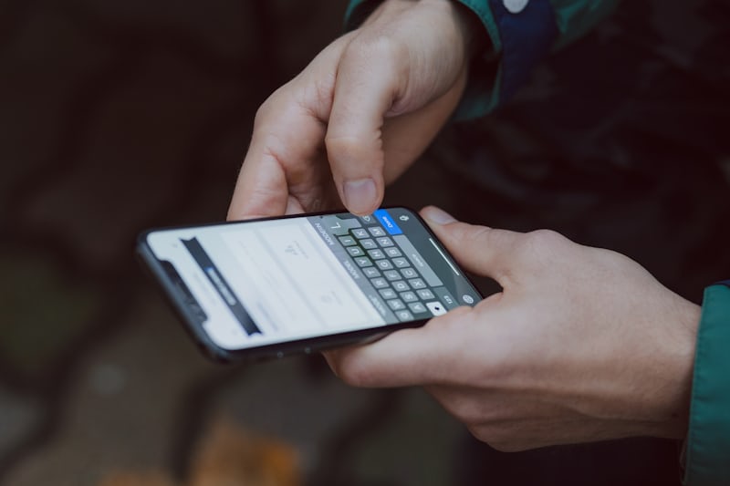 Person sending invoice on phone