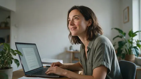 A job seeker working on a cover letter at home