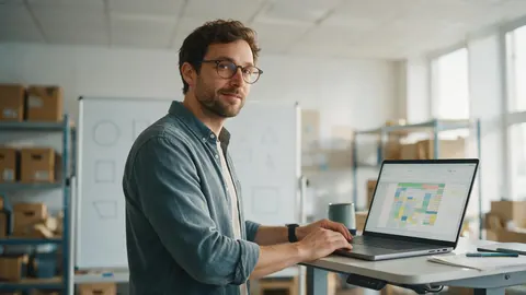 An operations lead reviewing a stock tracker on a laptop