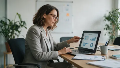 An HR manager preparing an onboarding presentation in an office