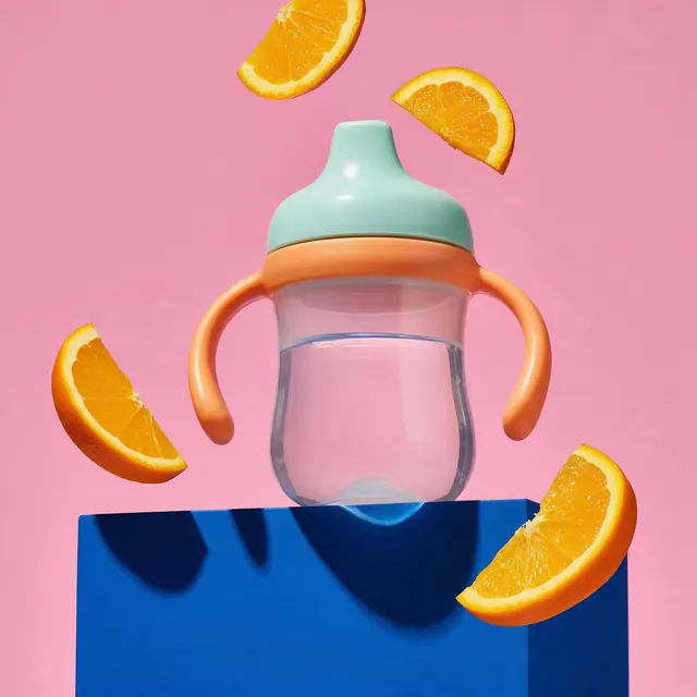 Sippy cup colour pop: AI-generated colour-pop ad image of a toddler sippy cup