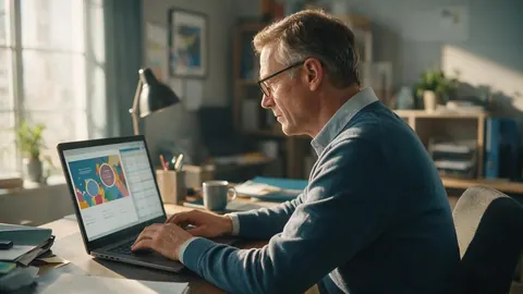 A consultant with a slide and a data sheet on his laptop