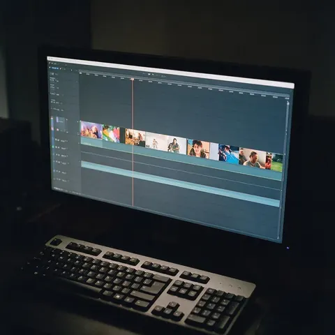 Editing timeline with several short clips on a monitor