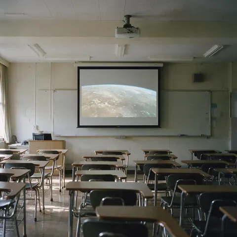 Classroom screen showing a planet surface video