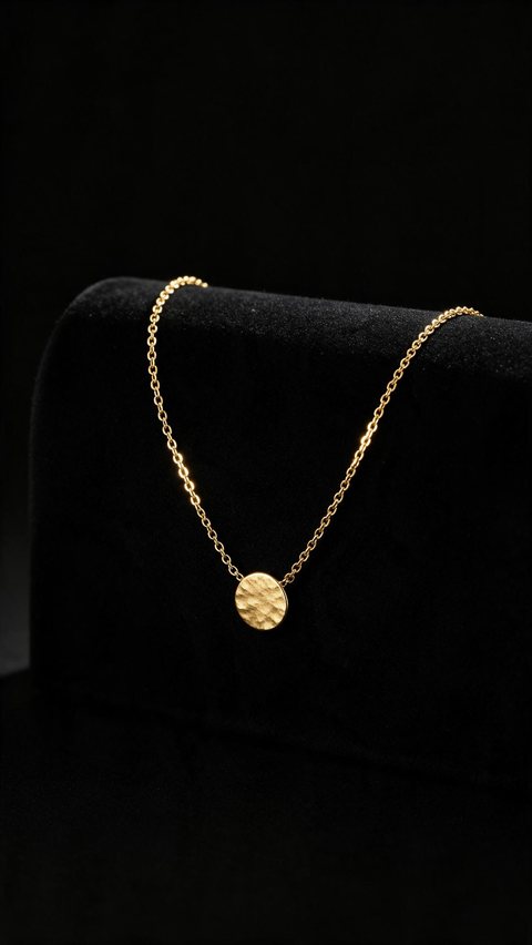 Gold pendant light sweep: AI-generated dark minimal clip: a gold pendant necklace under a sweeping light