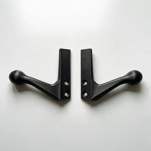Pair of mirrored 3D printed drawer handles on a table