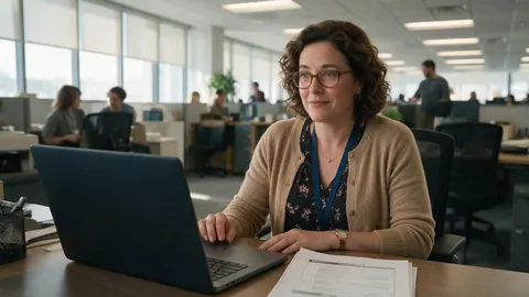 A training coordinator planning a course at her desk