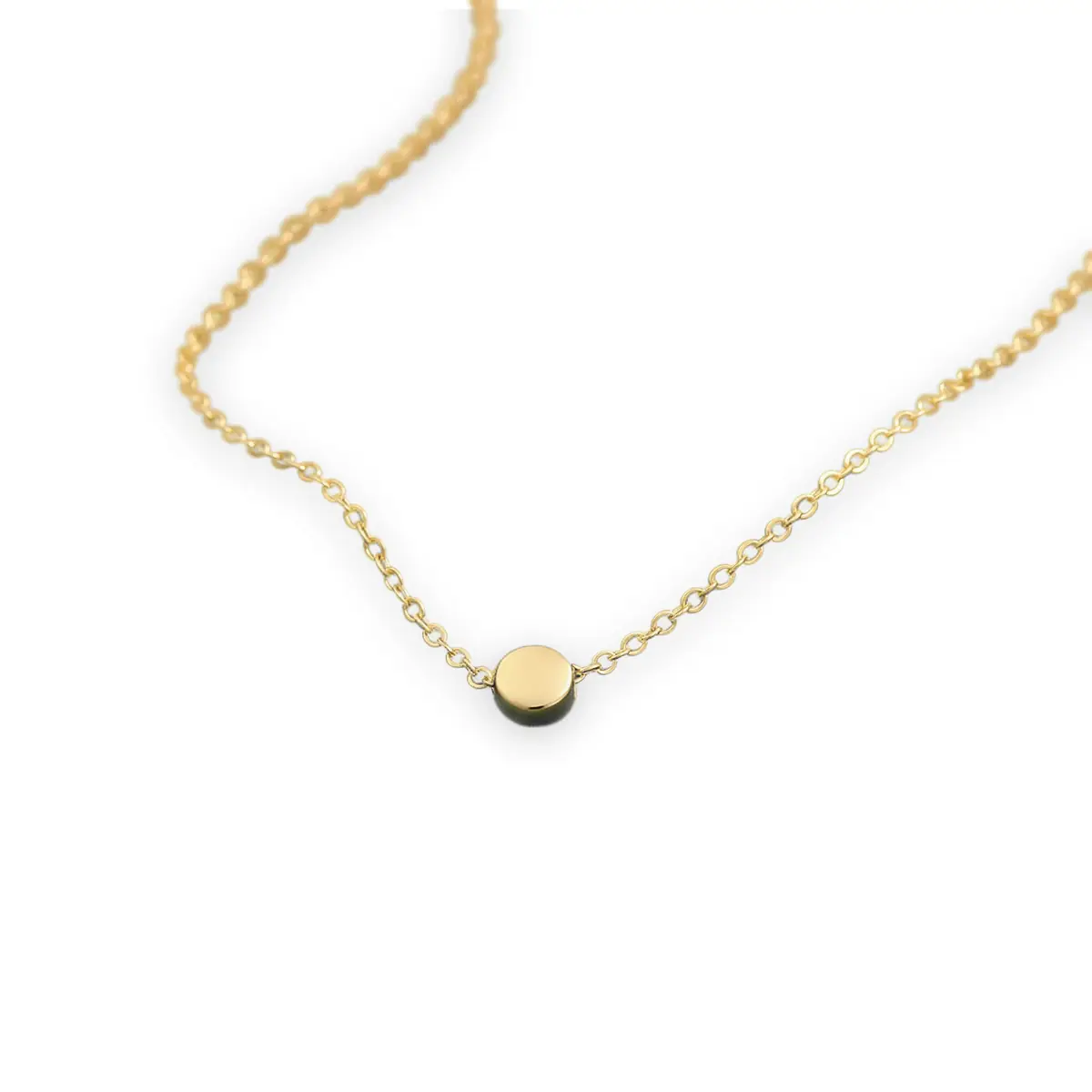Thin gold chain necklace on green velvet — background removed with Kenerate Cutout HD