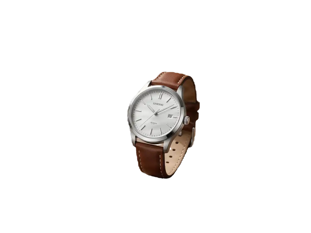 Silver wristwatch on a wooden table beside a coffee cup and notebook — after