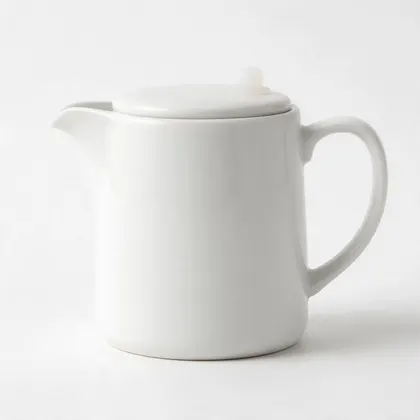 Original photo before the edit: Studio photo of a white ceramic jug on a plain white background