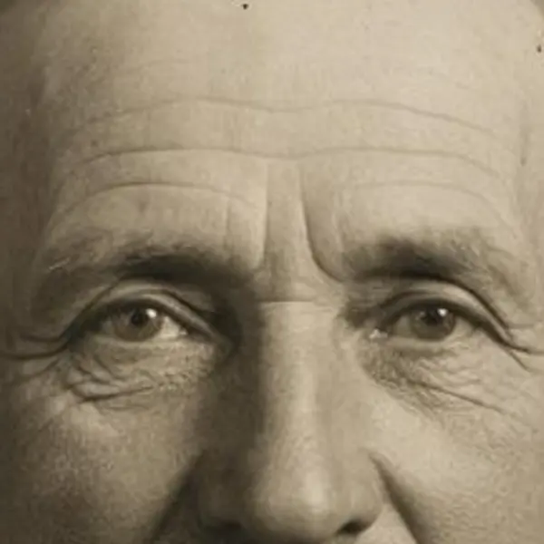 Damaged sepia studio portrait of an elderly man with a mustache — the Scanned print original stretched to the same size (bicubic)