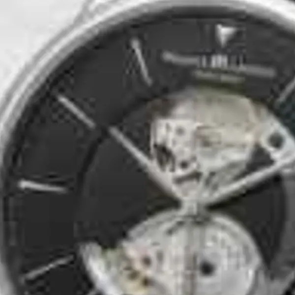 Silver wristwatch with a black leather strap on white marble — the 320 px JPEG original stretched to the same size (bicubic)