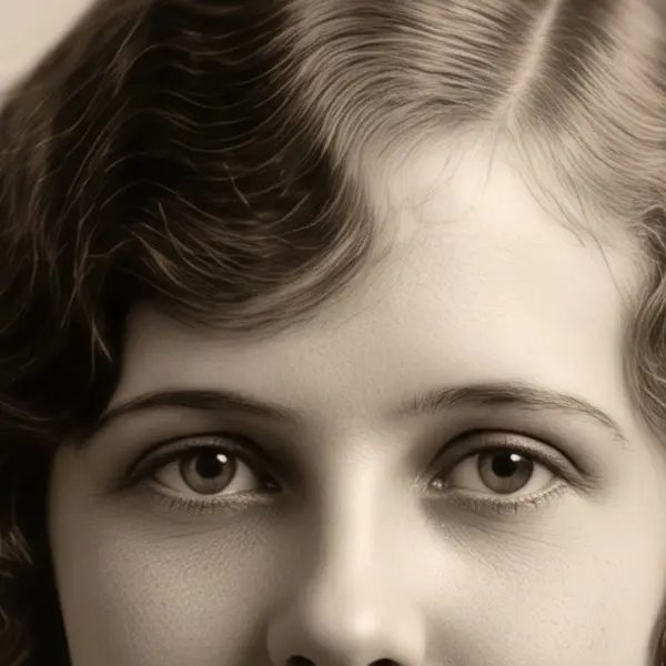 Water-stained, cracked 1920s sepia portrait of a young woman — the same crop after Phota Enhance