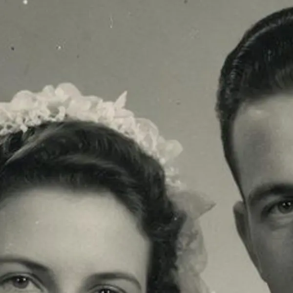 Torn, scratched 1940s black-and-white wedding portrait of a bride and groom — the Scanned print, torn original stretched to the same size (bicubic)